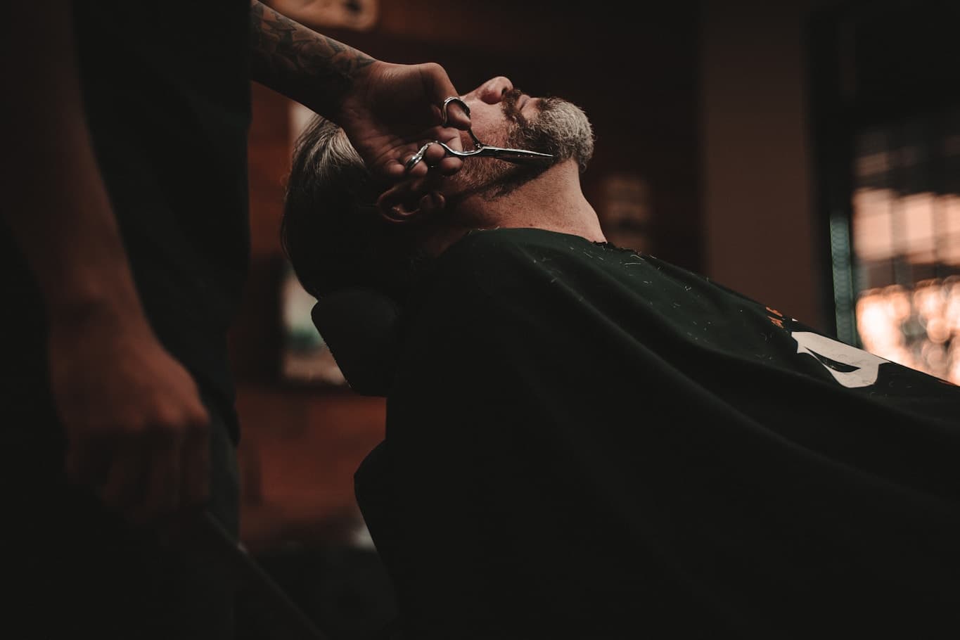 Professional Barber Shaving Client